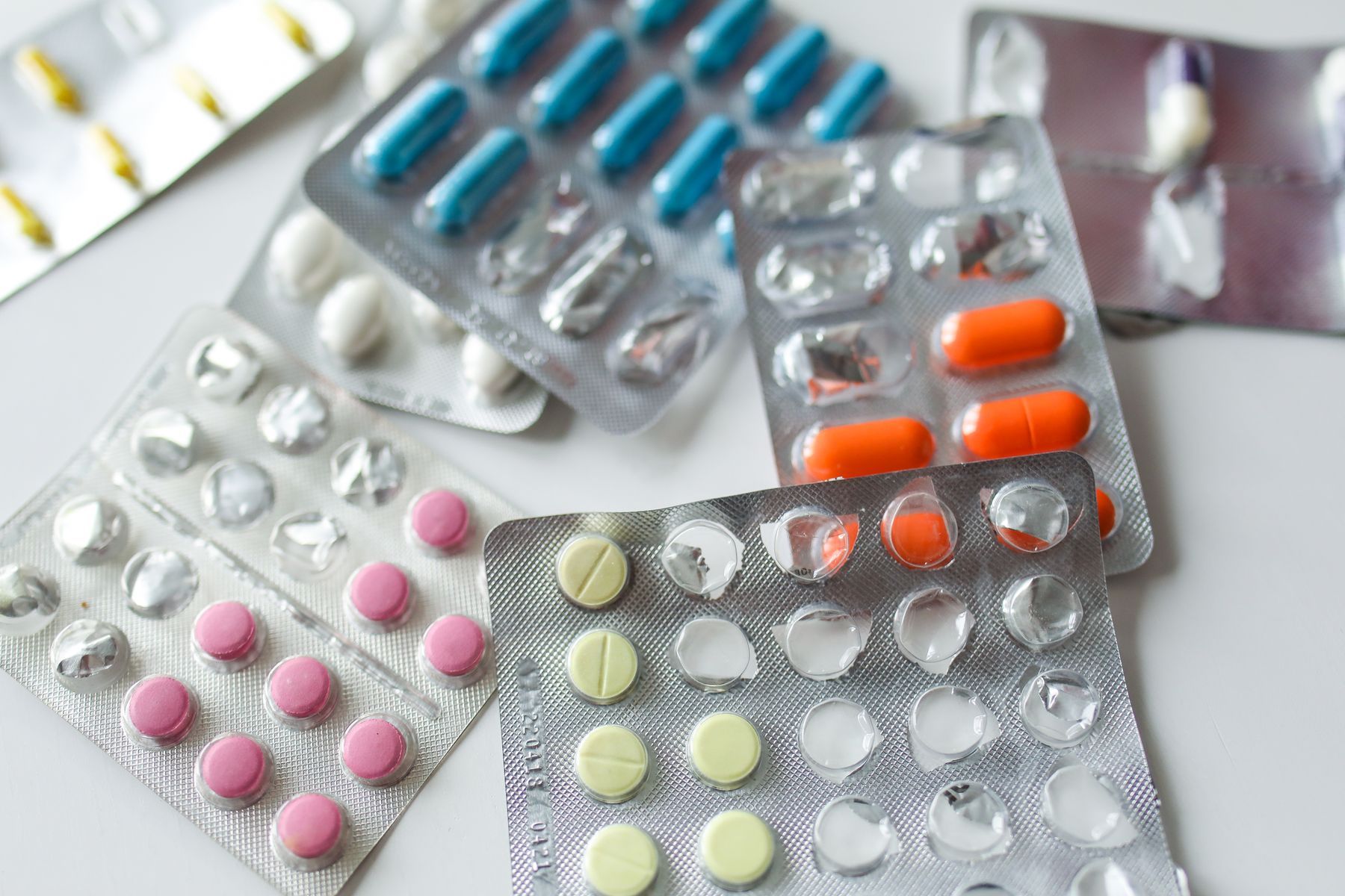 Assorted tablets and capsules in blister strips
